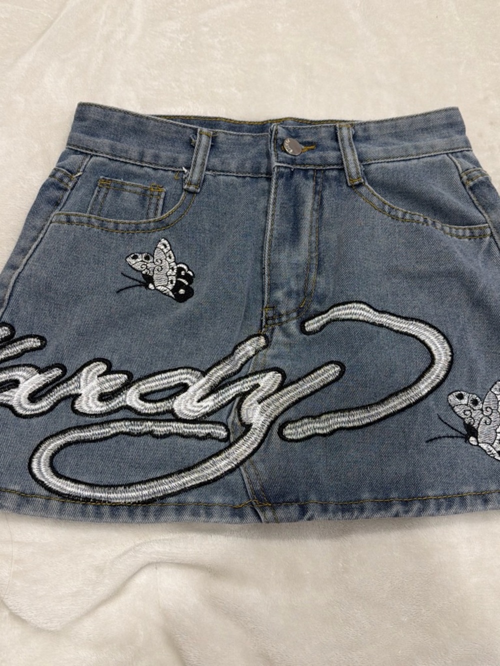 Ed Hardy Light Blue Denim Mini Skirt with White Embroidered Logo and Butterflies